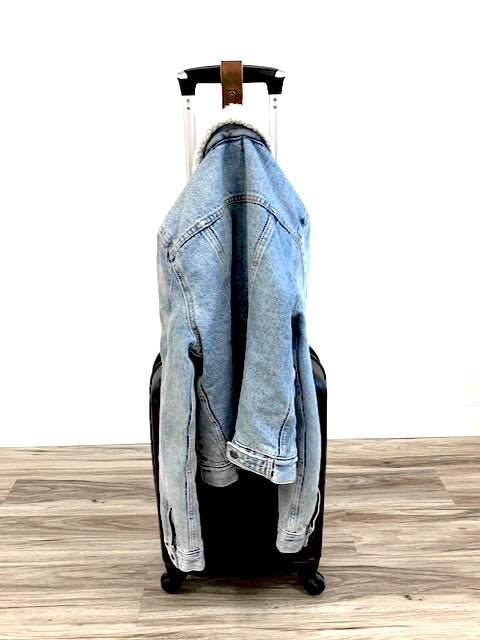 Hanger with coat on Front of Luggage 